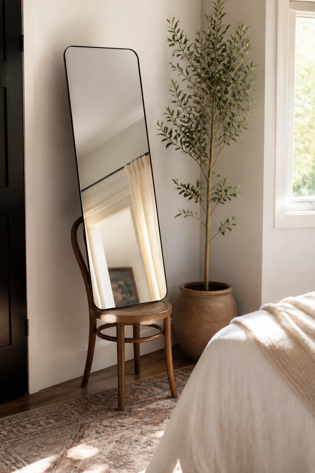 Place a full-length mirror against the wall propped on a chair