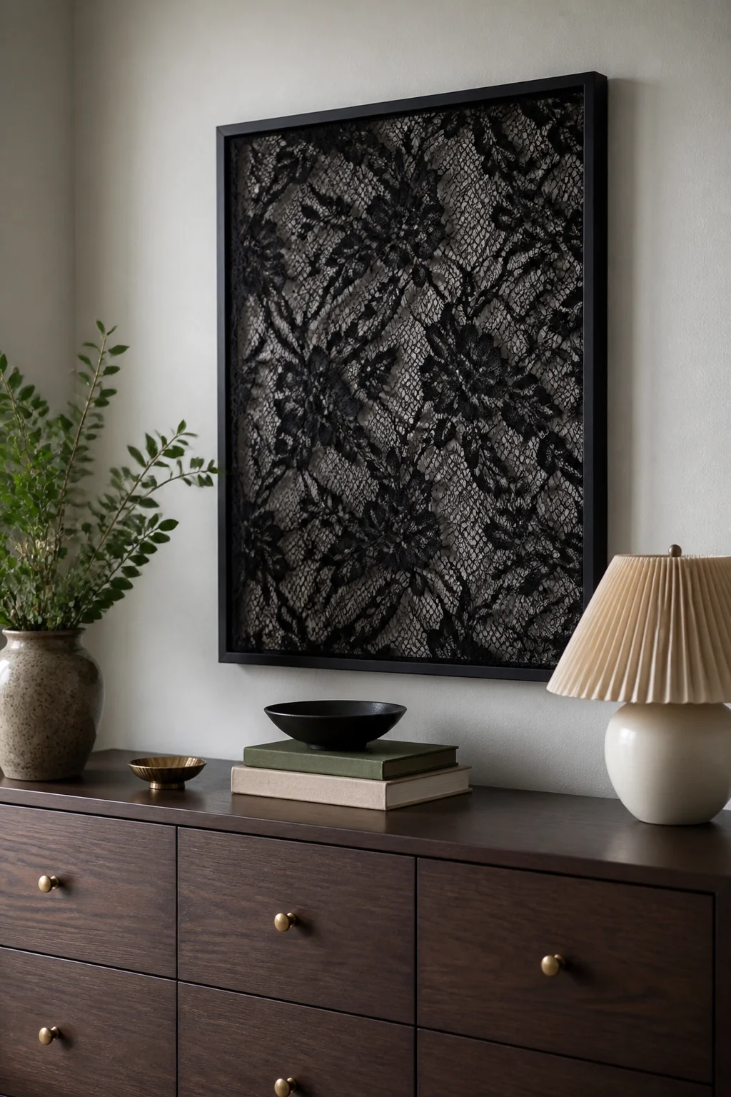 Black lace stretched over a frame as wall art